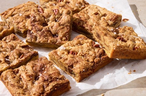 Banana Bread Bars cut up on parchment paper - select to zoom
