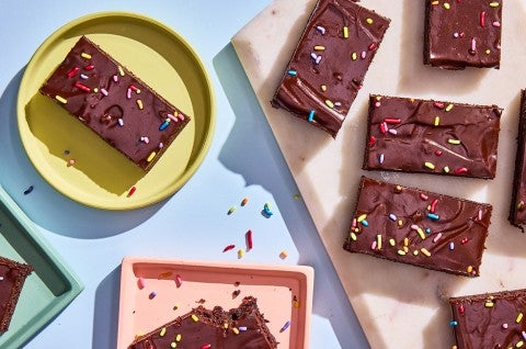 Easy Frosted Brownies served on plates and cutting board - select to zoom