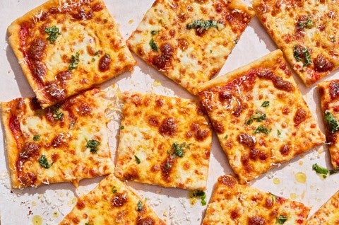 Sliced, freshly baked Gluten-Free Sheet Pan Pizza seen from above. - select to zoom