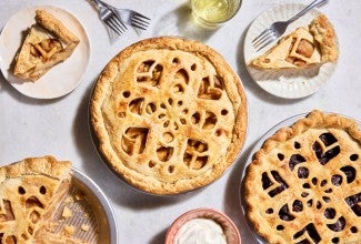 Double-crusted pies with pie designs in cut into the tops