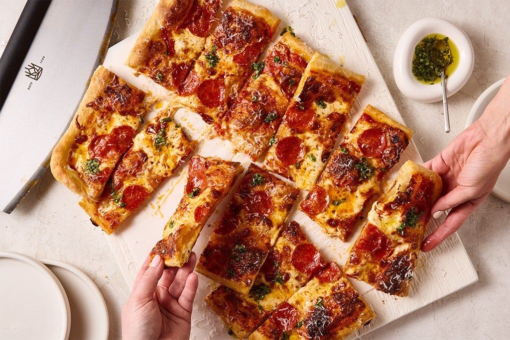 Pizza topped with pepperonis