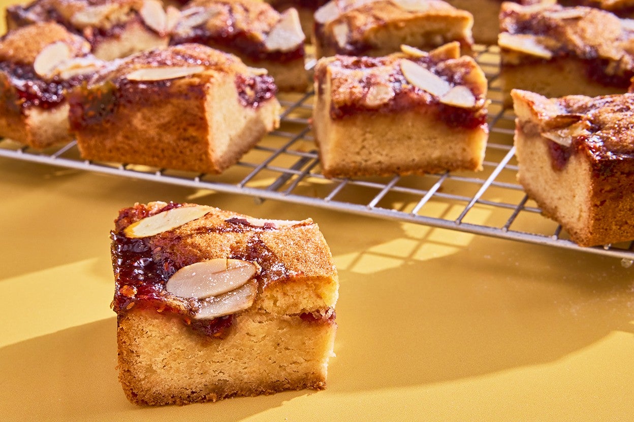 Raspberry Frangipane Bars sliced on a cooling rack