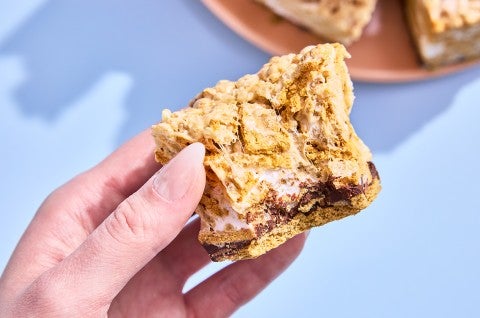 A hand holding a S’more Rice Krispies Treat - select to zoom