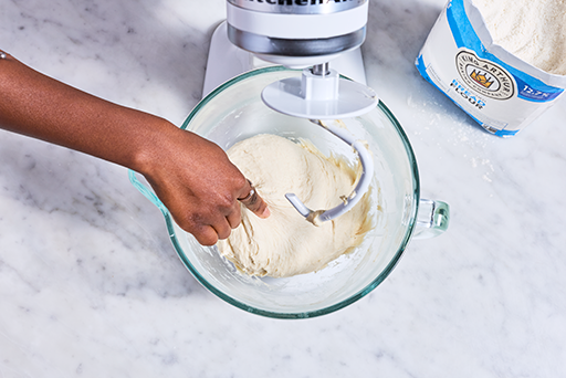 Pinching dough in a mixer for Pretzel Buns